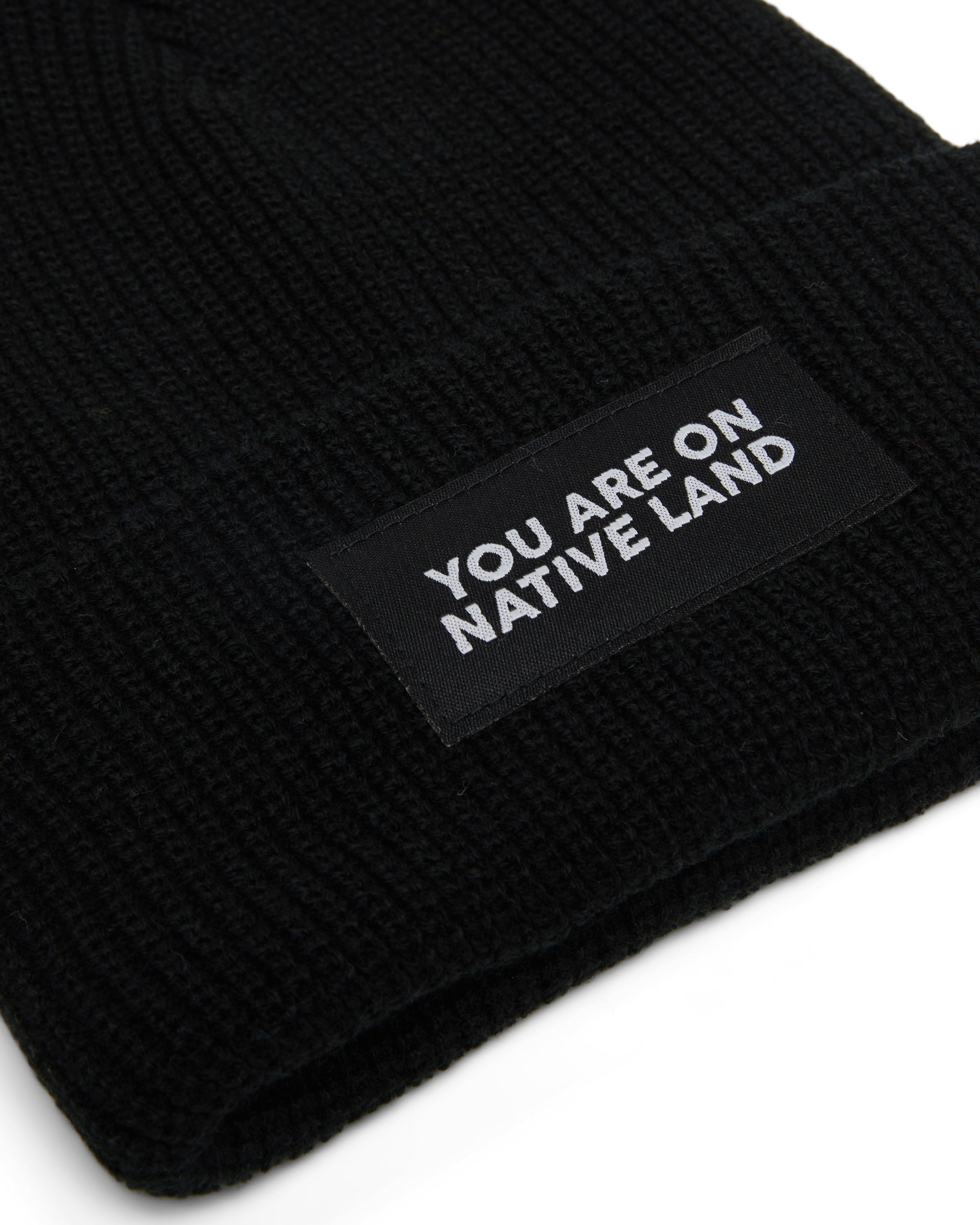 'YOU ARE ON NATIVE LAND' RIBBED BEANIE